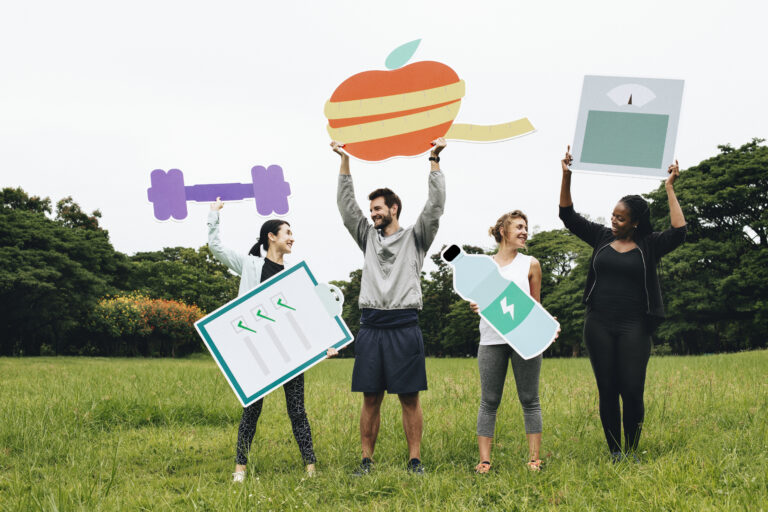 Happy diverse people working out in the park